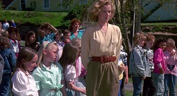 Movie still from “Kindergarten Cop” (1990), directed by Ivan Reitman – A group of people standing in front of each other; Medium shot, Over the shoulder angle