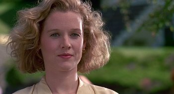 Movie still from “Kindergarten Cop” (1990), directed by Ivan Reitman – A person wearing a yellow shirt; Close Up shot, Low angle