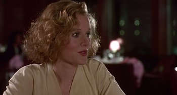 Movie still from “Kindergarten Cop” (1990), directed by Ivan Reitman – A person sitting in front of a window; Close Up shot, Over the shoulder angle