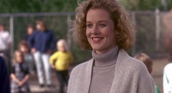 Movie still from “Kindergarten Cop” (1990), directed by Ivan Reitman – A person wearing a sweater; Close Up shot, Over the shoulder angle