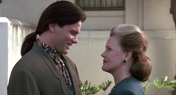Movie still from “Kindergarten Cop” (1990), directed by Ivan Reitman – A man and a woman standing next to each other; Close Up shot, Low angle