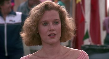 Movie still from “Kindergarten Cop” (1990), directed by Ivan Reitman – A person wearing a pink shirt; Close Up shot, Low angle