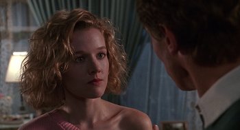 Movie still from “Kindergarten Cop” (1990), directed by Ivan Reitman – A man and a woman looking at one another in a room; Close Up shot, Over the shoulder angle