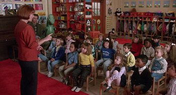 Movie still from “Kindergarten Cop” (1990), directed by Ivan Reitman – A group of children sitting in a room; Wide shot, High angle