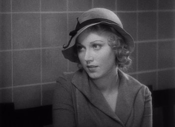 Movie still from “King Kong” (1933), directed by Merian C. Cooper – A black and white photo of a woman wearing a hat; Close Up shot, High angle