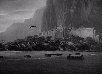 Movie still from “King Kong” (1933), directed by Merian C. Cooper – A black - and - white photo of a boat in the water; Extreme Wide shot, High angle