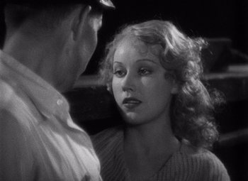 Movie still from “King Kong” (1933), directed by Merian C. Cooper – An old photo of a man and a woman talking to each other; Close Up shot, Over the shoulder angle