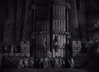 Movie still from “King Kong” (1933), directed by Merian C. Cooper – A black and white photo of a scene in a play; Extreme Wide shot, Low angle