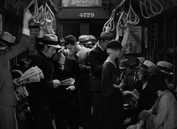 Movie still from “King Kong” (1933), directed by Merian C. Cooper – A group of people standing on top of a subway train; Wide shot, High angle