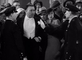 Movie still from “King Kong” (1933), directed by Merian C. Cooper – A group of men and women standing next to each other; Medium shot, High angle