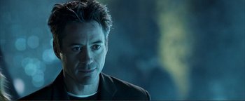 Movie still from “Kiss Kiss Bang Bang” (2005), directed by Shane Black – A person wearing a suit; Close Up shot, Over the shoulder angle