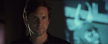 Movie still from “Kiss Kiss Bang Bang” (2005), directed by Shane Black – A person in a dark room; Close Up shot, Low angle
