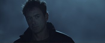 Movie still from “Kiss Kiss Bang Bang” (2005), directed by Shane Black – A person wearing a black jacket; Close Up shot, Over the shoulder angle