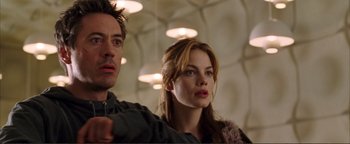 Movie still from “Kiss Kiss Bang Bang” (2005), directed by Shane Black – A man and a woman standing next to each other in a room; Close Up shot, Low angle