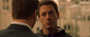 Movie still from “Kiss Kiss Bang Bang” (2005), directed by Shane Black – A person looking at a mirror; Close Up shot, Over the shoulder angle