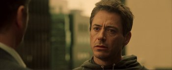 Movie still from “Kiss Kiss Bang Bang” (2005), directed by Shane Black – A person wearing a hoodie; Close Up shot, Over the shoulder angle