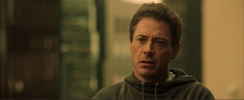 Movie still from “Kiss Kiss Bang Bang” (2005), directed by Shane Black – A person wearing a hooded sweatshirt; Close Up shot, Low angle