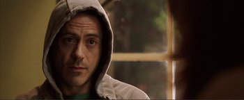 Movie still from “Kiss Kiss Bang Bang” (2005), directed by Shane Black – A person wearing a hooded jacket; Close Up shot, Over the shoulder angle