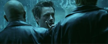 Movie still from “Kiss Kiss Bang Bang” (2005), directed by Shane Black – A man looking at himself in the mirror; Close Up shot, Over the shoulder angle