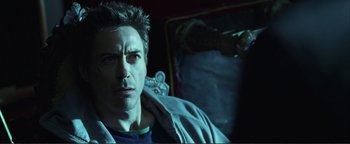 Movie still from “Kiss Kiss Bang Bang” (2005), directed by Shane Black – A person wearing a blue jacket; Close Up shot, High angle