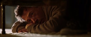 Movie still from “Kiss Kiss Bang Bang” (2005), directed by Shane Black – A person laying on a bed; Close Up shot, Overhead angle