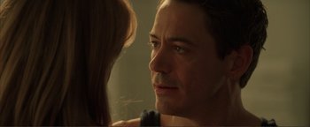 Movie still from “Kiss Kiss Bang Bang” (2005), directed by Shane Black – A person looking at a man in a mirror; Close Up shot, Over the shoulder angle