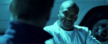 Movie still from “Kiss Kiss Bang Bang” (2005), directed by Shane Black – A person wearing a white shirt; Close Up shot, Low angle