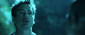 Movie still from “Kiss Kiss Bang Bang” (2005), directed by Shane Black – A person wearing a blue shirt; Close Up shot, Low angle