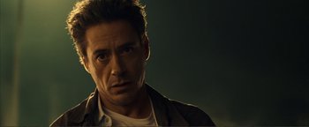Movie still from “Kiss Kiss Bang Bang” (2005), directed by Shane Black – A person wearing a jacket; Close Up shot, Over the shoulder angle