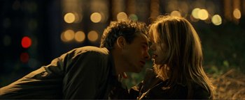 Movie still from “Kiss Kiss Bang Bang” (2005), directed by Shane Black – A man and a woman are kissing in the dark; Close Up shot, Low angle