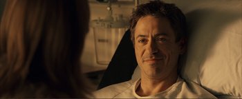 Movie still from “Kiss Kiss Bang Bang” (2005), directed by Shane Black – A person sitting in front of a mirror; Close Up shot, Over the shoulder angle