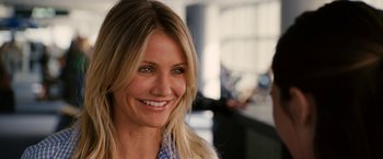 Movie still from “Knight and Day” (2010), directed by James Mangold – A person with a smile on their face; Close Up shot, Over the shoulder angle