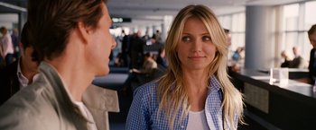 Movie still from “Knight and Day” (2010), directed by James Mangold – Two women talking to each other in an airport terminal; Close Up shot, Over the shoulder angle