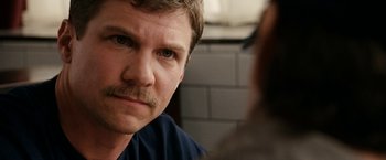 Movie still from “Knight and Day” (2010), directed by James Mangold – A person with a mustache; Close Up shot, Over the shoulder angle