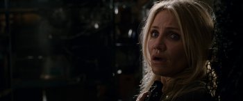 Movie still from “Knight and Day” (2010), directed by James Mangold – A woman with a surprised look on her face; Close Up shot, Over the shoulder angle