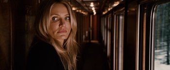 Movie still from “Knight and Day” (2010), directed by James Mangold – A woman standing in a hallway looking at the camera; Close Up shot, Over the shoulder angle