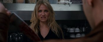 Movie still from “Knight and Day” (2010), directed by James Mangold – A person sitting in a room; Close Up shot, Over the shoulder angle