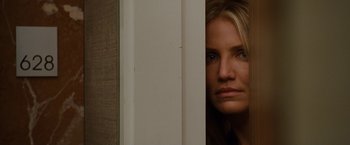 Movie still from “Knight and Day” (2010), directed by James Mangold – A person with her head on a wall; Close Up shot, Over the shoulder angle