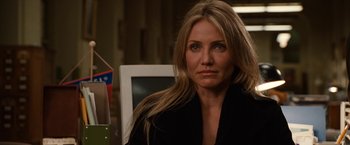 Movie still from “Knight and Day” (2010), directed by James Mangold – A person sitting in a chair; Close Up shot, Over the shoulder angle