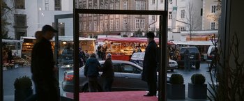 Movie still from “Knight and Day” (2010), directed by James Mangold – A group of people standing on the side of the street; Wide shot, Over the shoulder angle
