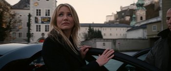 Movie still from “Knight and Day” (2010), directed by James Mangold – A beautiful blonde haired woman leaning on a car window; Close Up shot, Low angle