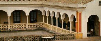 Movie still from “Knight and Day” (2010), directed by James Mangold – A group of people standing on a balcony; Extreme Wide shot, High angle