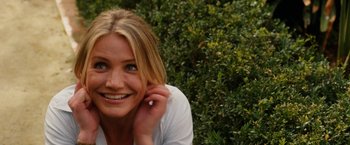 Movie still from “Knight and Day” (2010), directed by James Mangold – A beautiful blond woman smiling for the camera; Close Up shot, High angle
