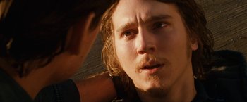 Movie still from “Knight and Day” (2010), directed by James Mangold – A person with long hair looking at the camera; Close Up shot, Over the shoulder angle