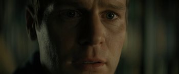 Movie still from “Knock at the Cabin” (2023), directed by M. Night Shyamalan – A man's face in the dark; Extreme Close Up shot, Low angle