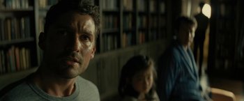 Movie still from “Knock at the Cabin” (2023), directed by M. Night Shyamalan – A man and a child in a room; Close Up shot, Over the shoulder angle