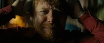 Movie still from “Knock at the Cabin” (2023), directed by M. Night Shyamalan – A person with a beard; Close Up shot, High angle