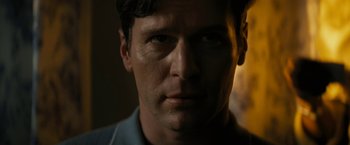 Movie still from “Knock at the Cabin” (2023), directed by M. Night Shyamalan – A man's face in the dark; Close Up shot, Low angle