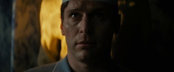 Movie still from “Knock at the Cabin” (2023), directed by M. Night Shyamalan – A man's face in the dark; Close Up shot, Low angle