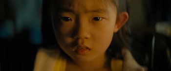 Movie still from “Knock at the Cabin” (2023), directed by M. Night Shyamalan – A young girl's face; Close Up shot, High angle